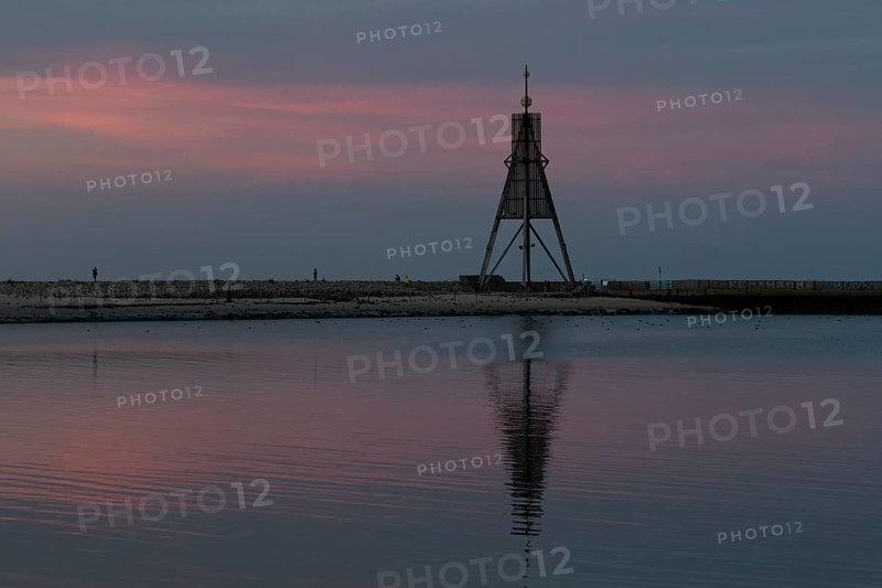 Kugelbake with water reflection in the sunset
