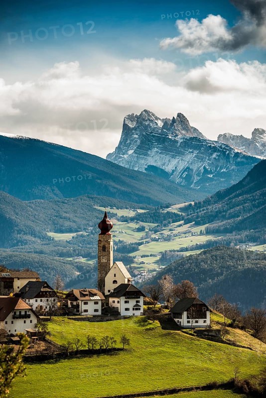 Snow-covered mountains and church