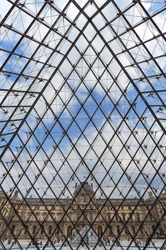 View from inside the pyramid to the buildings of the Louvre