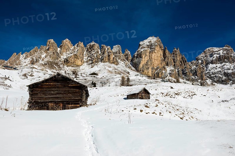Snow-covered mountains and alpine hut