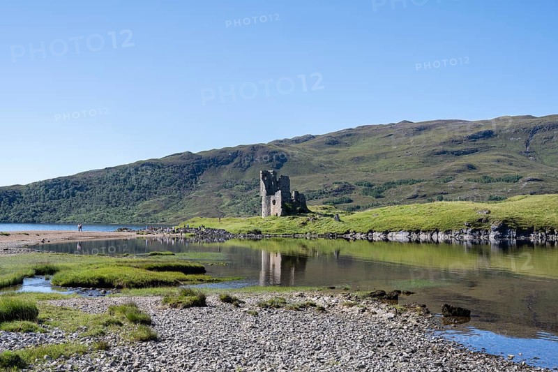The ruins of Ardvreck Castle on a peninsula in the freshwater loch of Loch Assynt