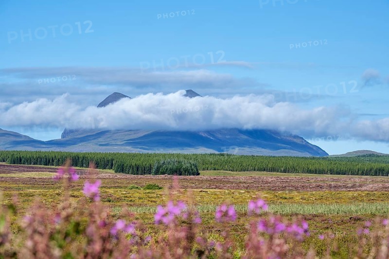 A band of clouds passes by the 849 m high mountain Cul Mor