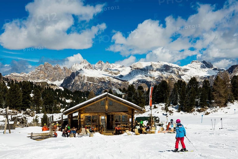 Snow-covered mountains and ski hut