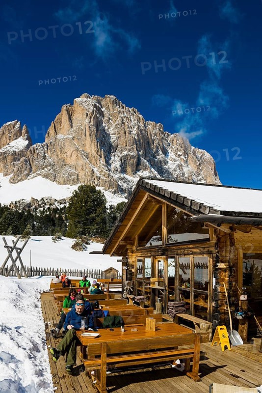 Snow-covered mountains and ski hut