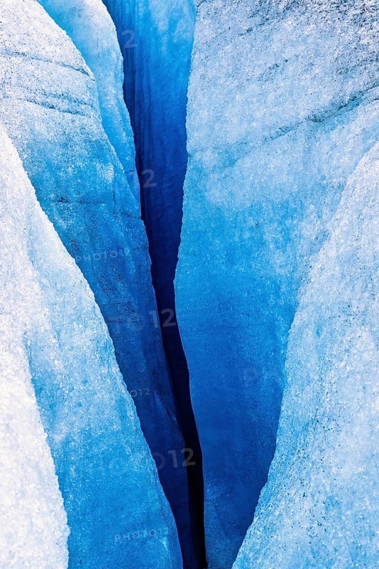 Melting glacier with a deep crevasse