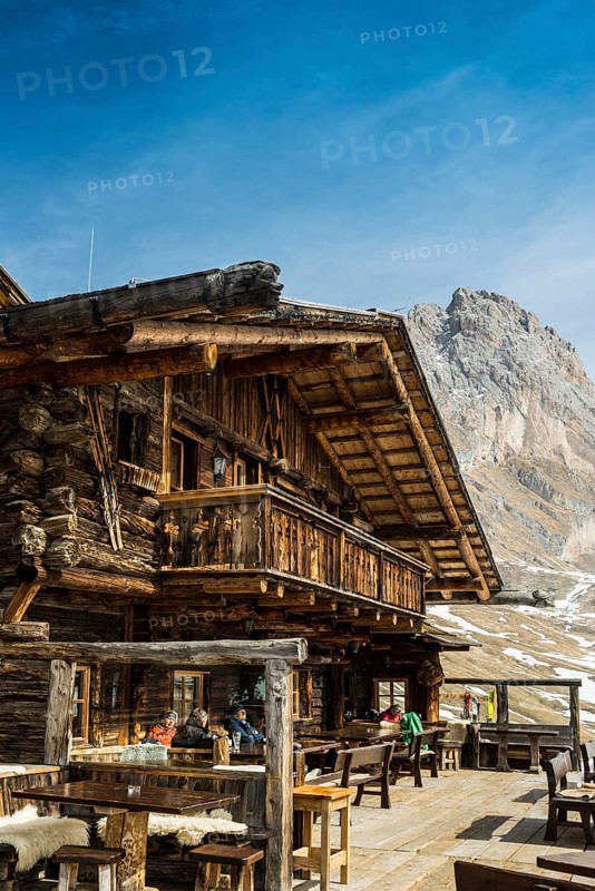 Snow-covered mountains and ski hut