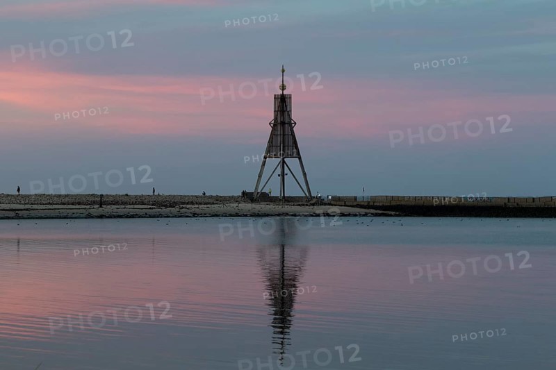 Kugelbake with water reflection in the sunset