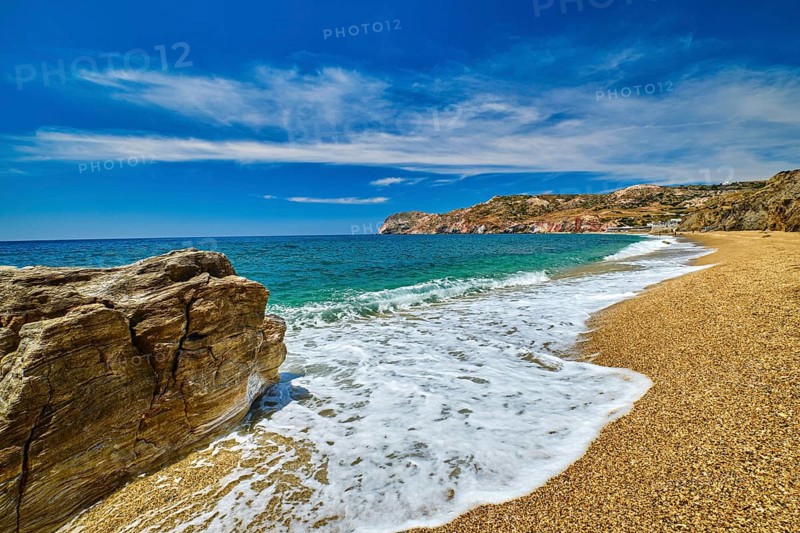Sunny summer day on pebble and sandy beach Paleochori beach