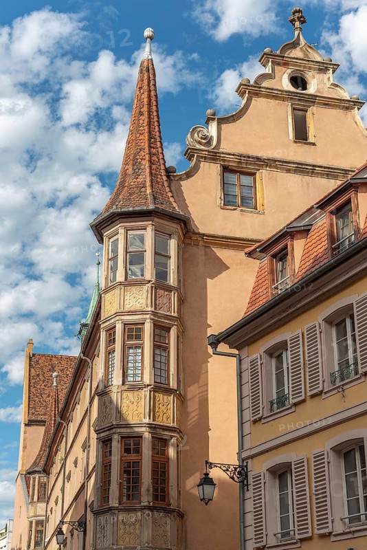 Turret of an old building in a city centre. Colmar