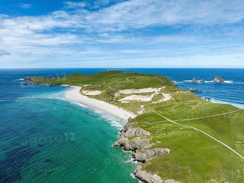 Aerial view of Faraid Head peninsula with dunes and sandy beach