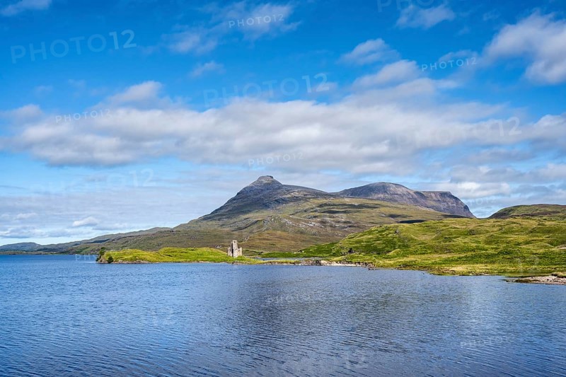 The ruins of Ardvreck Castle on a peninsula by the loch of Loch Assynt