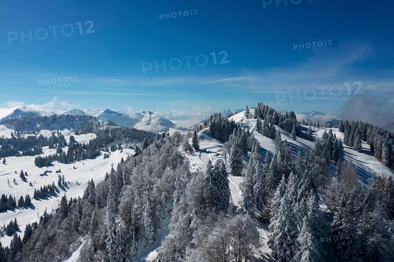 Winter landscape covered in deep snow on the Zwoelferhorn with a view of the Pillstein