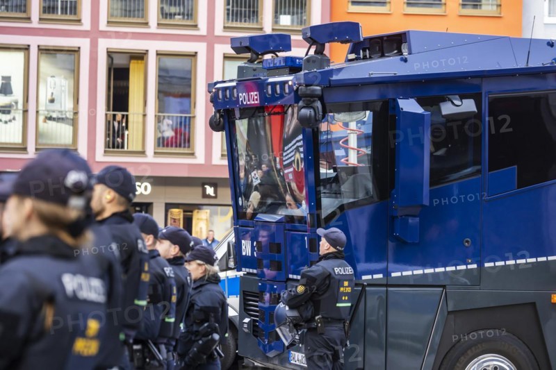 Water cannon and police in the city centre