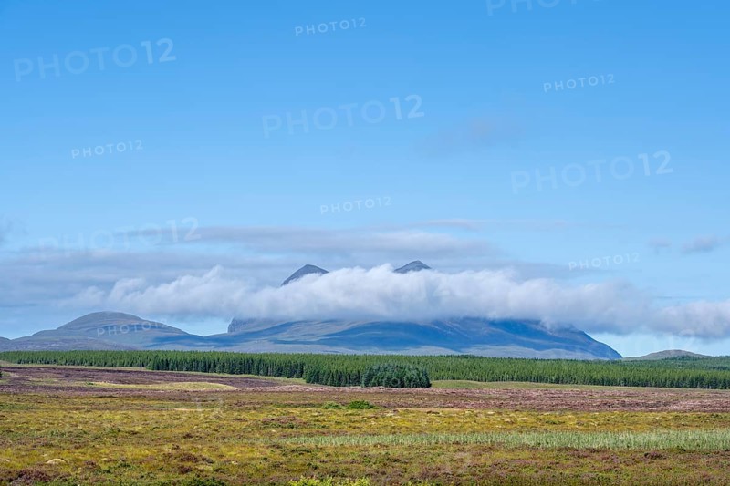 A band of clouds passes by the 849 m high mountain Cul Mor
