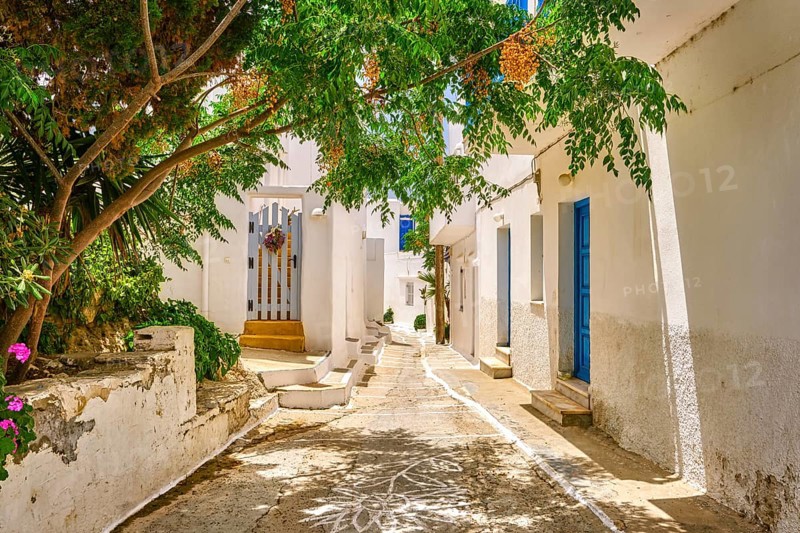 Cosy traditional summer streets and beautiful walkways of Greek town