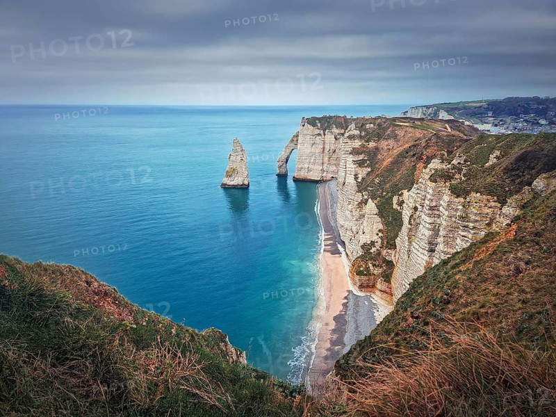 Sightseeing view to the famous rock Aiguille of Etretat in Normandy
