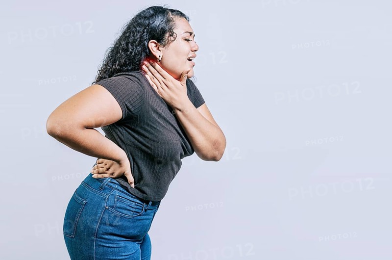 Neck pain and stress concept. Young girl suffering with neck pain isolated. People with neck tension