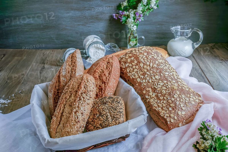 Loaves and loaves of rustic artisan bread made with different types of seeds and flours