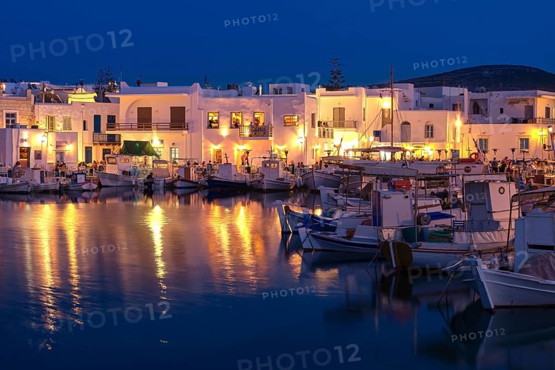 Traditional Greek fishing village and harbour after sunset