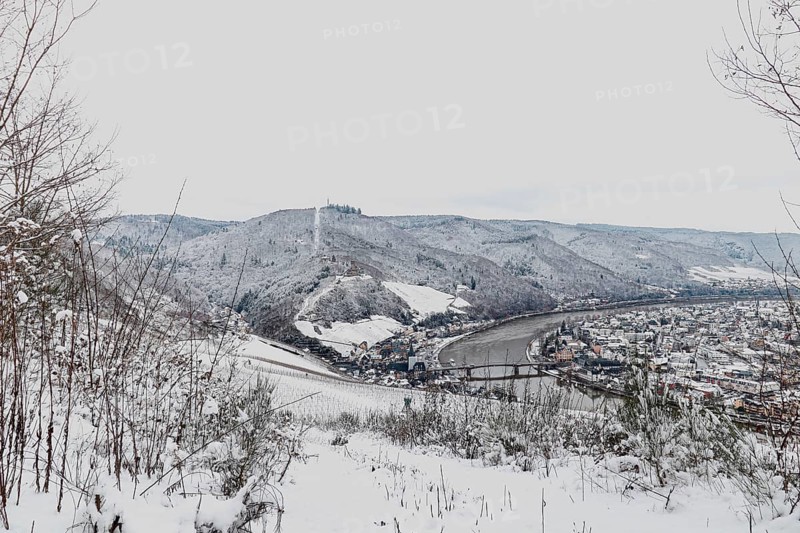Snow covered landscape of Mosel Valley and river