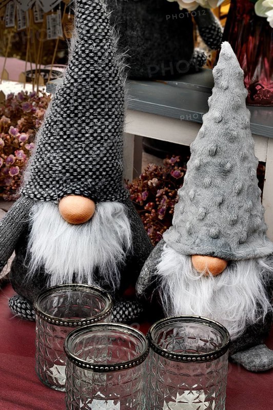 Dwarfs with long beards and huge woolly hats in a garden centre