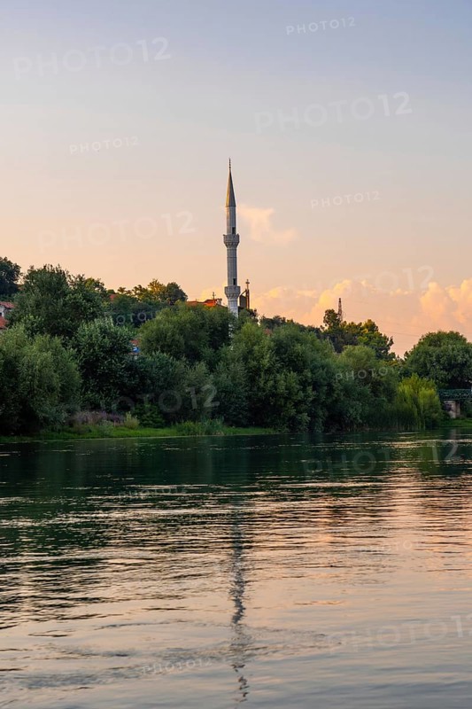 View of Kisha Katolike Eternit Capucin from a boat on a sightseeing excursion on Lake Shkoder in Shiroka. Albania