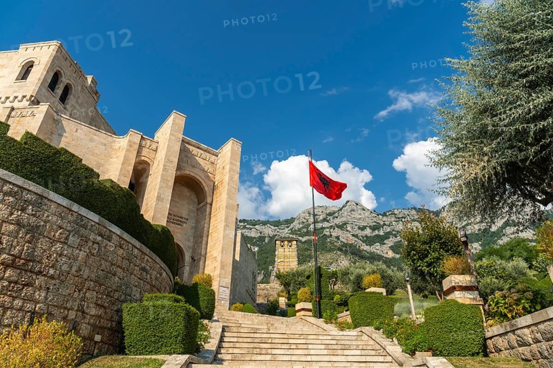 Stairs inside Kruje Castle and its fortress with the walls and mountains in the background. Albania