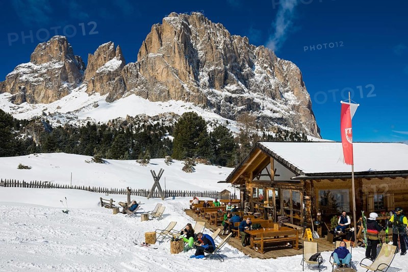 Snow-covered mountains and ski hut