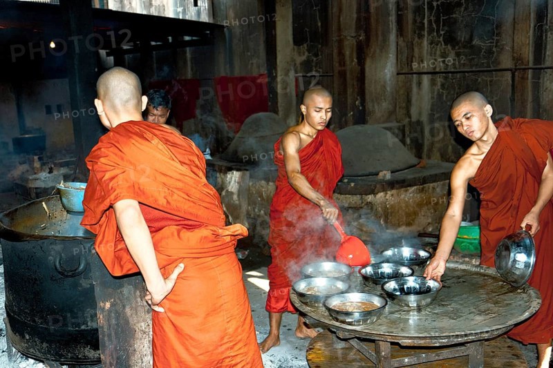 Monks cook food in monastery school of Bago