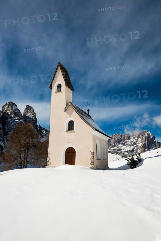 Snow-covered mountains and chapel
