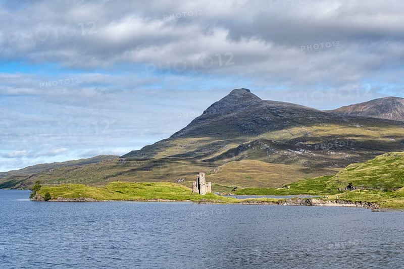 The ruins of Ardvreck Castle on a peninsula by the loch of Loch Assynt
