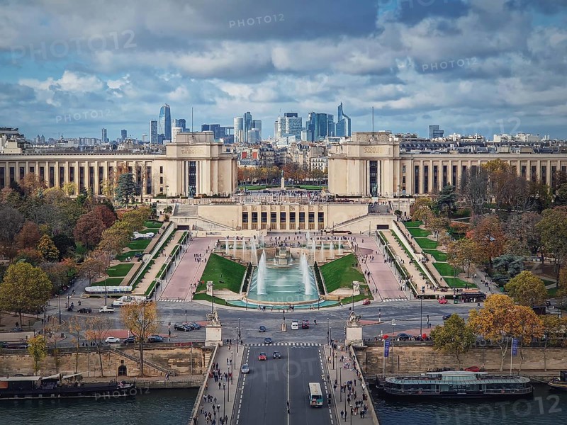 Closeup aerial view of the Trocadero area with La Defense metropolitan district seen at the horizon in Paris