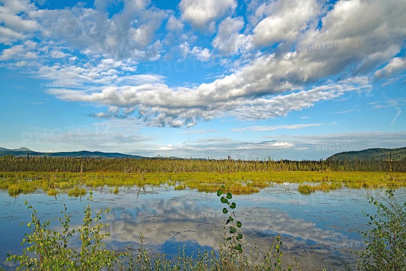 Clouds reflected in a crystal clear