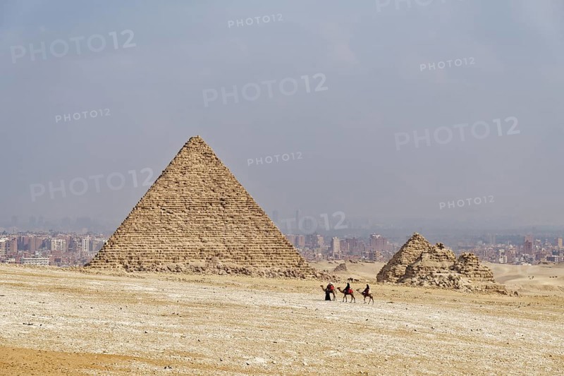 Camel guides and camels in front of the Mykerinos Pyramid and the Queen's Pyramids