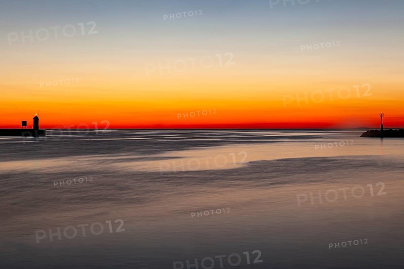 Sunset at the port entrance of Porec