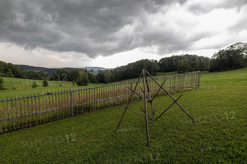 Rainy weather with meadow and farm