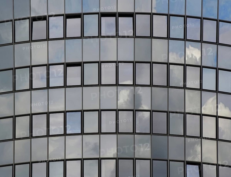 The sky is reflected in a modern
