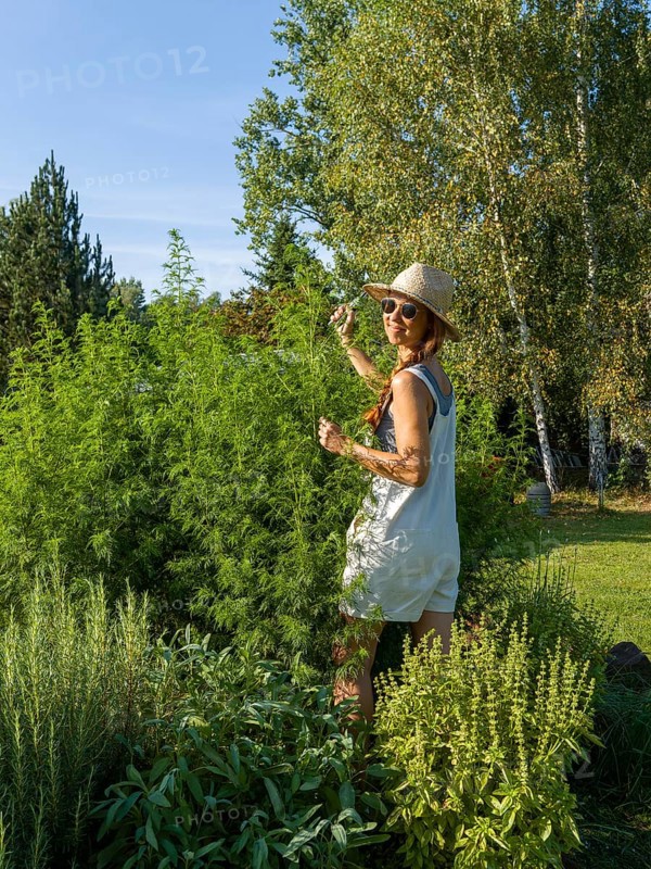 Woman in herb bed