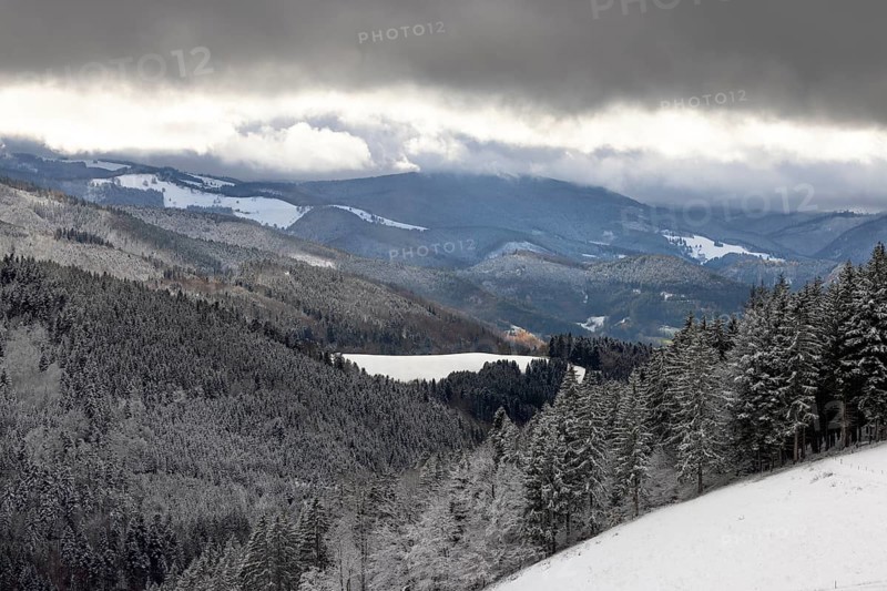 Fresh snow in November with a wonderful view of the Black Forest in a cloudy atmosphere