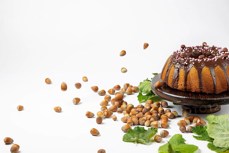 Vegan hazelnut cake on wooden serving plate
