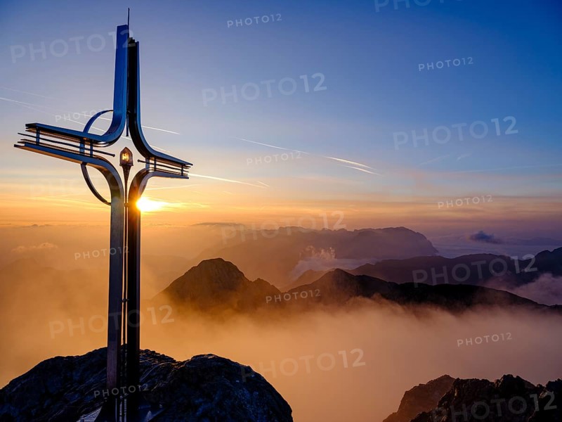 Summit cross Hoher Goell at sunrise