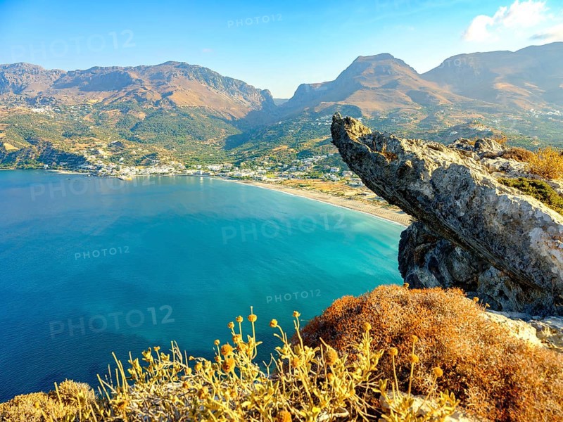 View over a cliff onto the bay and beach of Plakias