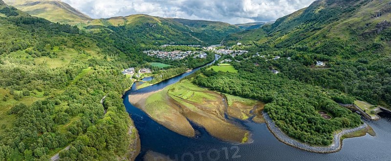 Aerial panorama of the village of Kinlochleven with the mouth of the River Leven at the eastern part of the freshwater loch Lochleven