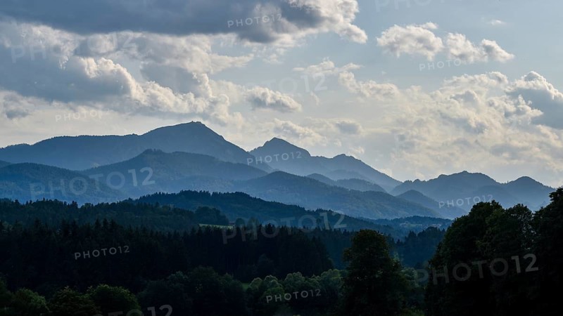 View of the forests in the Alpine foothills in Chiemgau with Hochfelln and Hochgern