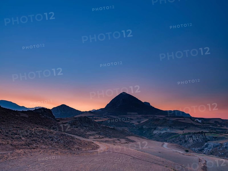 Mount Timios Stavros above harvested fields at dawn