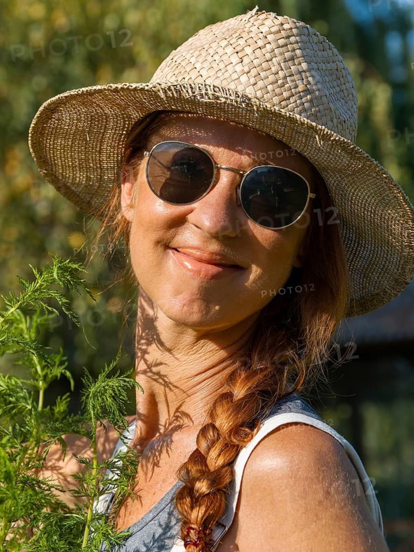 Woman in herb bed
