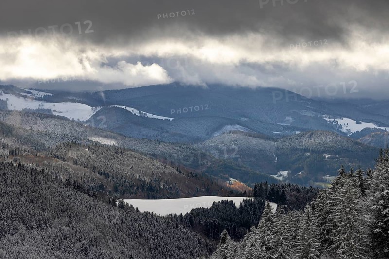 Fresh snow in November with a wonderful view of the Black Forest in a cloudy atmosphere