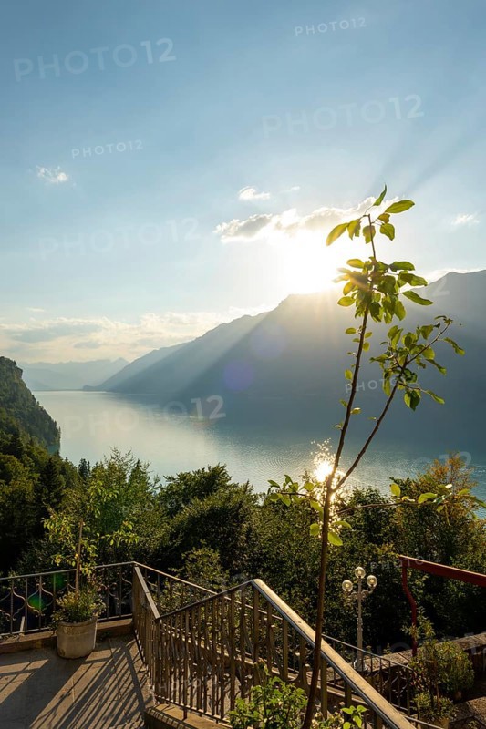 The Historical Grandhotel Giessbach with View over Mountain and Lake Brienz with Sunlight in Giessbach