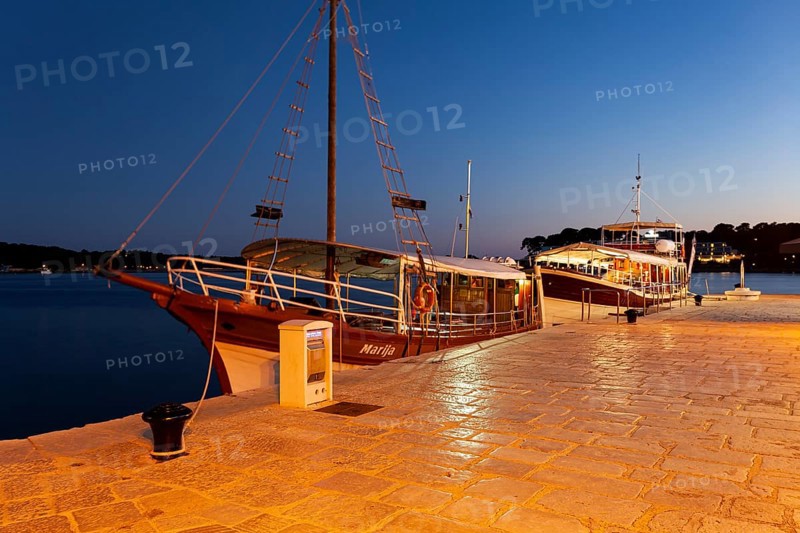 Excursion boats in the evening at the harbor of Porec
