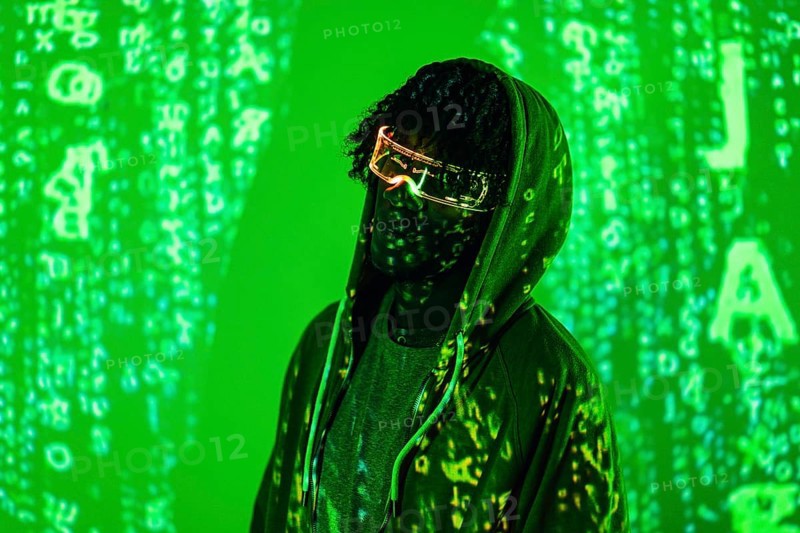 Futuristic portrait of a man with Artificial intelligence glasses with green neon lights